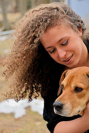 girl smiling with dog