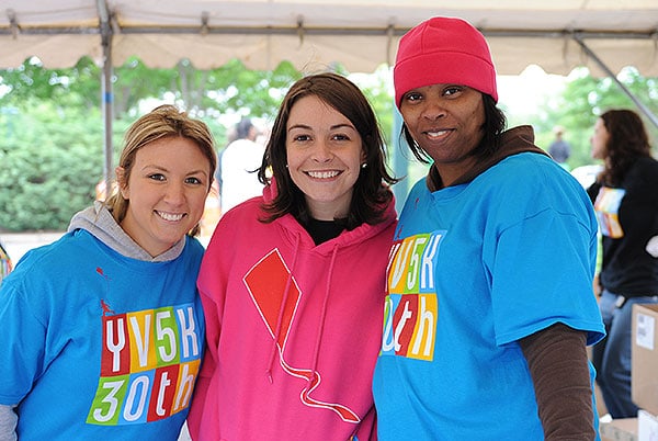 Volunteers staffing a tent at the YV5K event