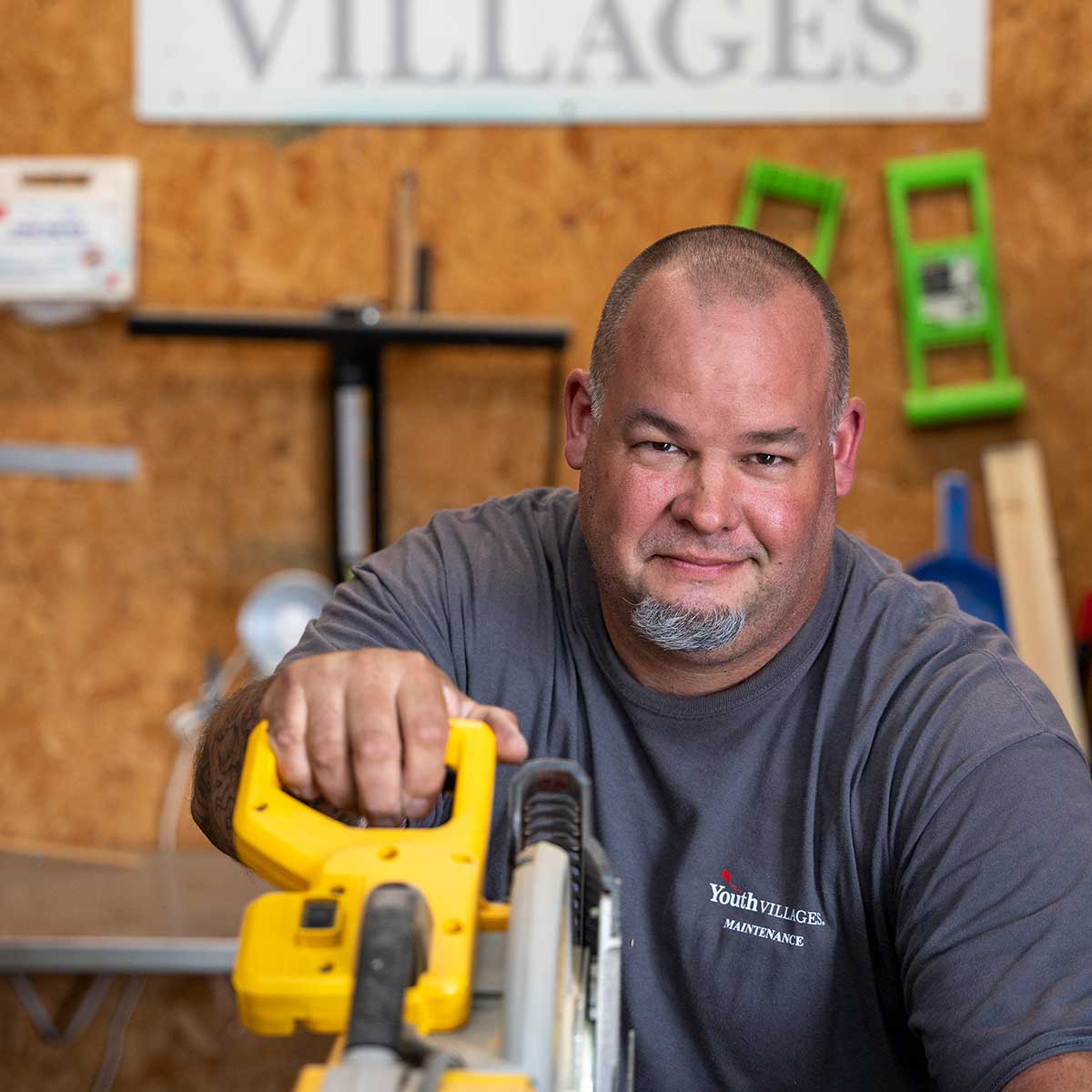 Maintenance staff with saw