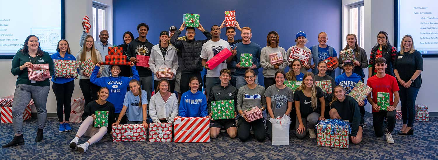 University of Memphis Athletics department with wrapped presents