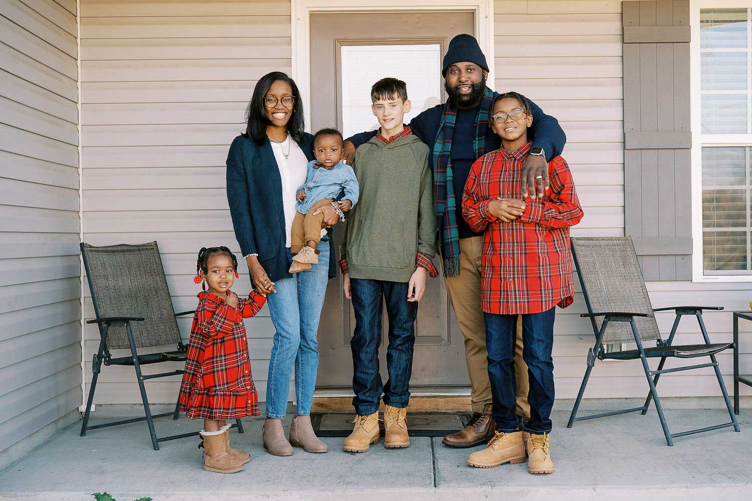 Foster parents Dominique and Kevin Gill with their family