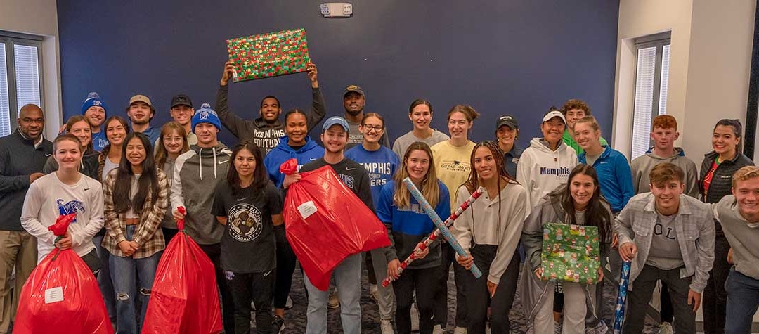 Memphis Tigers host wrapping party for gifts for Youth Villages children