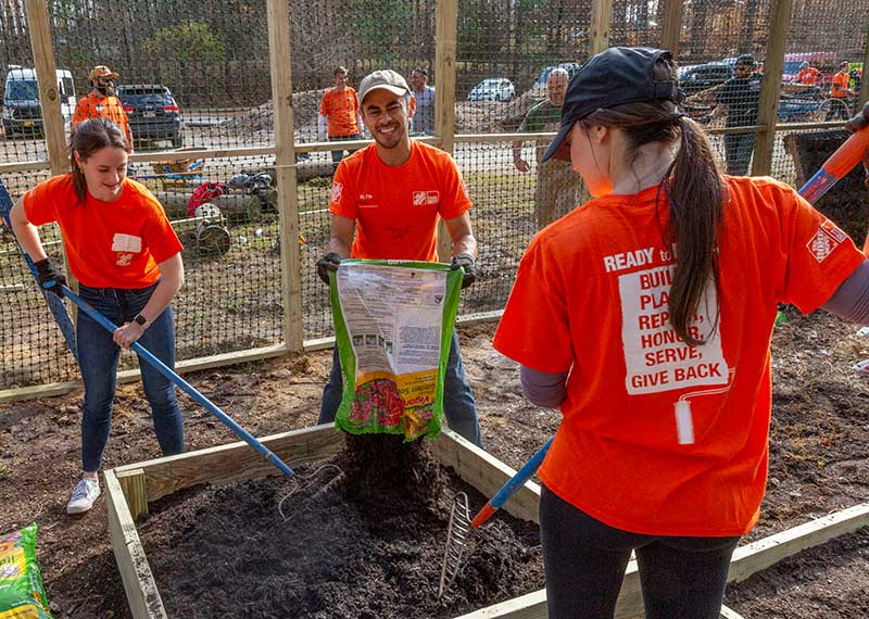 Home Depot volunteers gardening at Youth Villages Inner Harbour Campus
