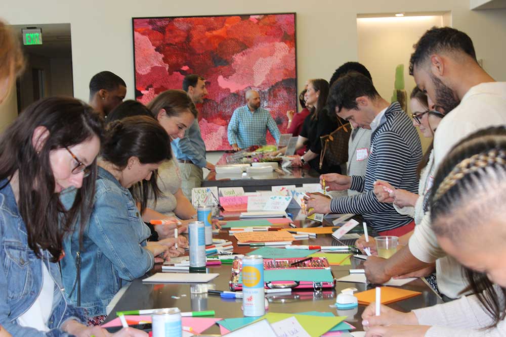young professionals creating cards for youth