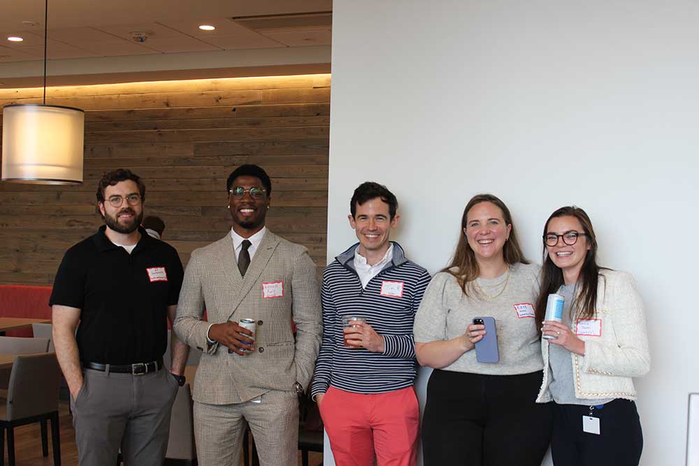 young professionals posing for photo