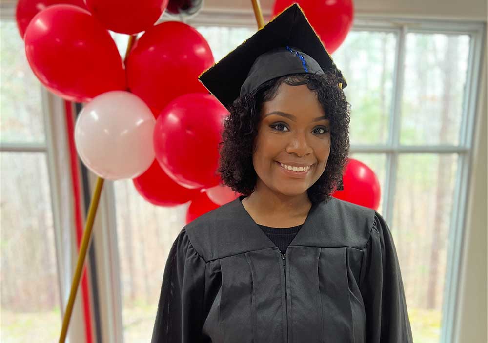 LifeSet participant, Tione in her graduation cap and gown
