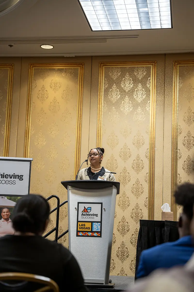 Tyra speaking at Achieving Success convening