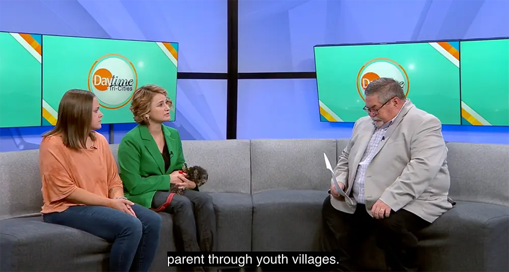 Foster parent and Youth Villages foster care staff sit down to talk with Daytime Tri-Cities
