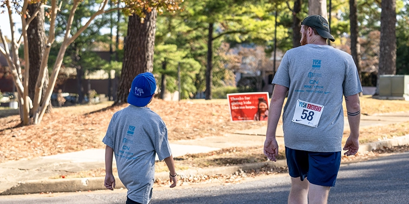 mentor and mentee walking at Youth Villages YV5K