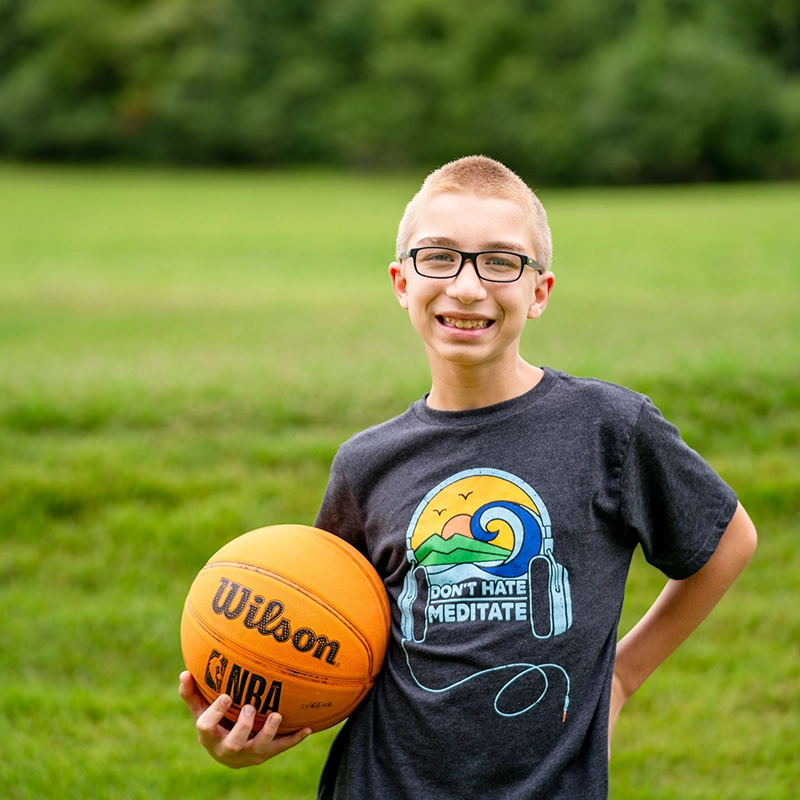 youth holding basketball