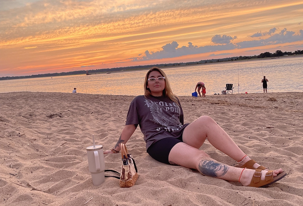 LifeSet participant, Naomi at the beach during sunset