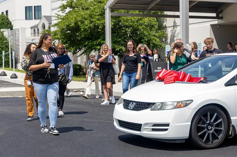 Graduate with surprise gift of a car