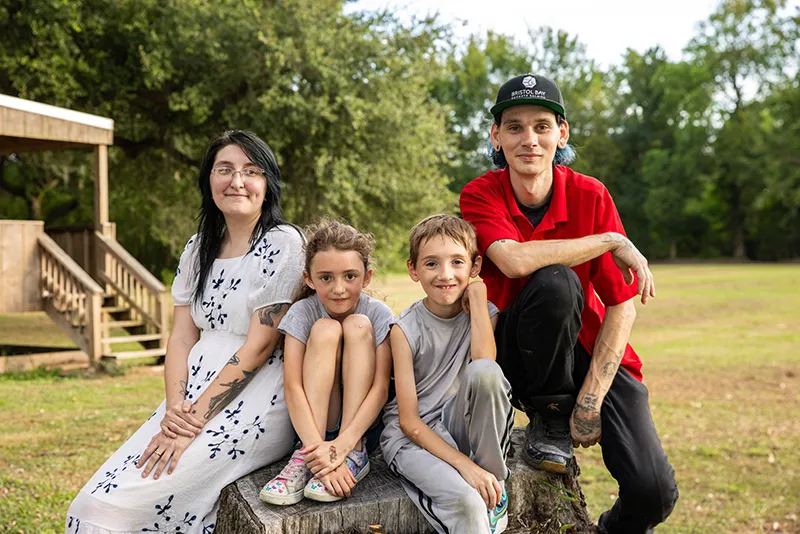 Youth Villages Intercept family sitting down smiling