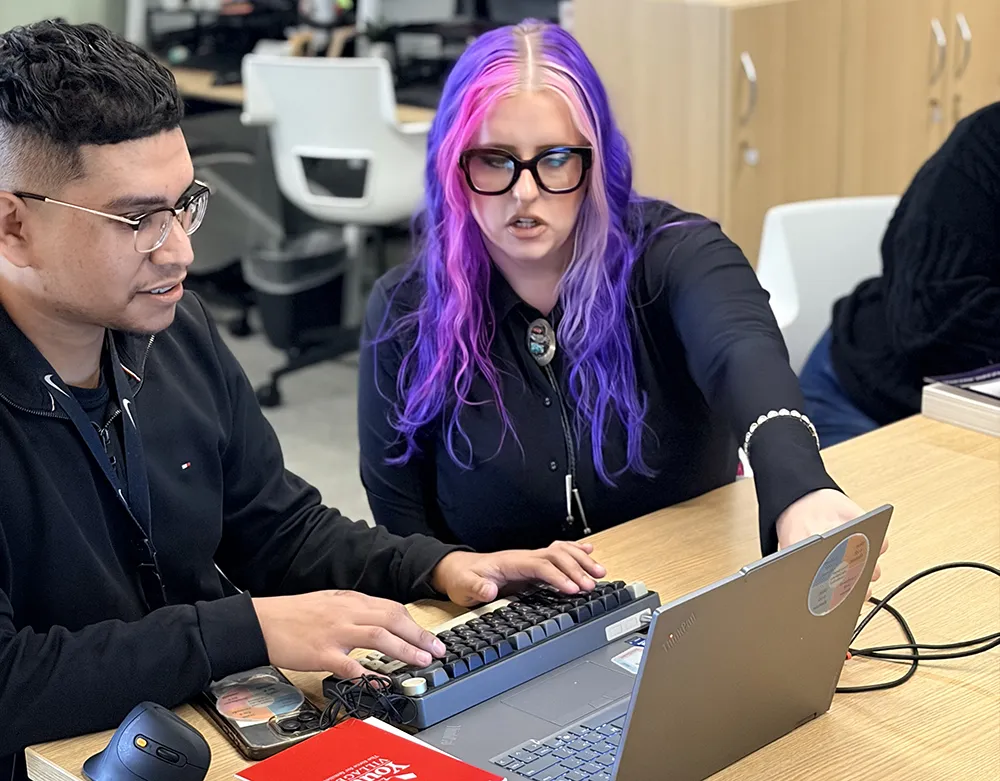 Madi working with a coworker