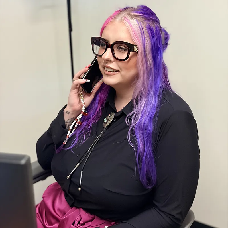 Madi in the office on the phone